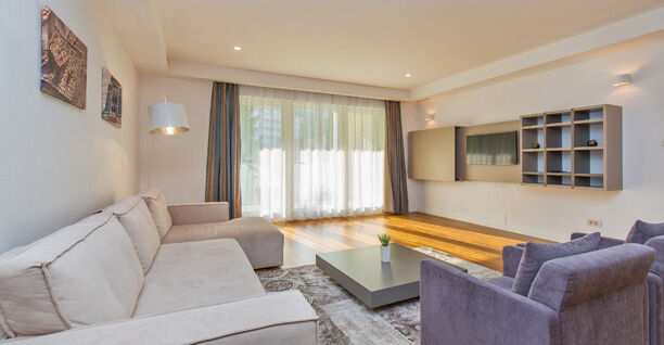 Deluxe Three-Bedroom Apartment with Terrace and Partial Sea View